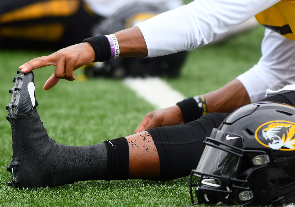 Kelly Bryant stretches his calf muscles at the beginning of practice